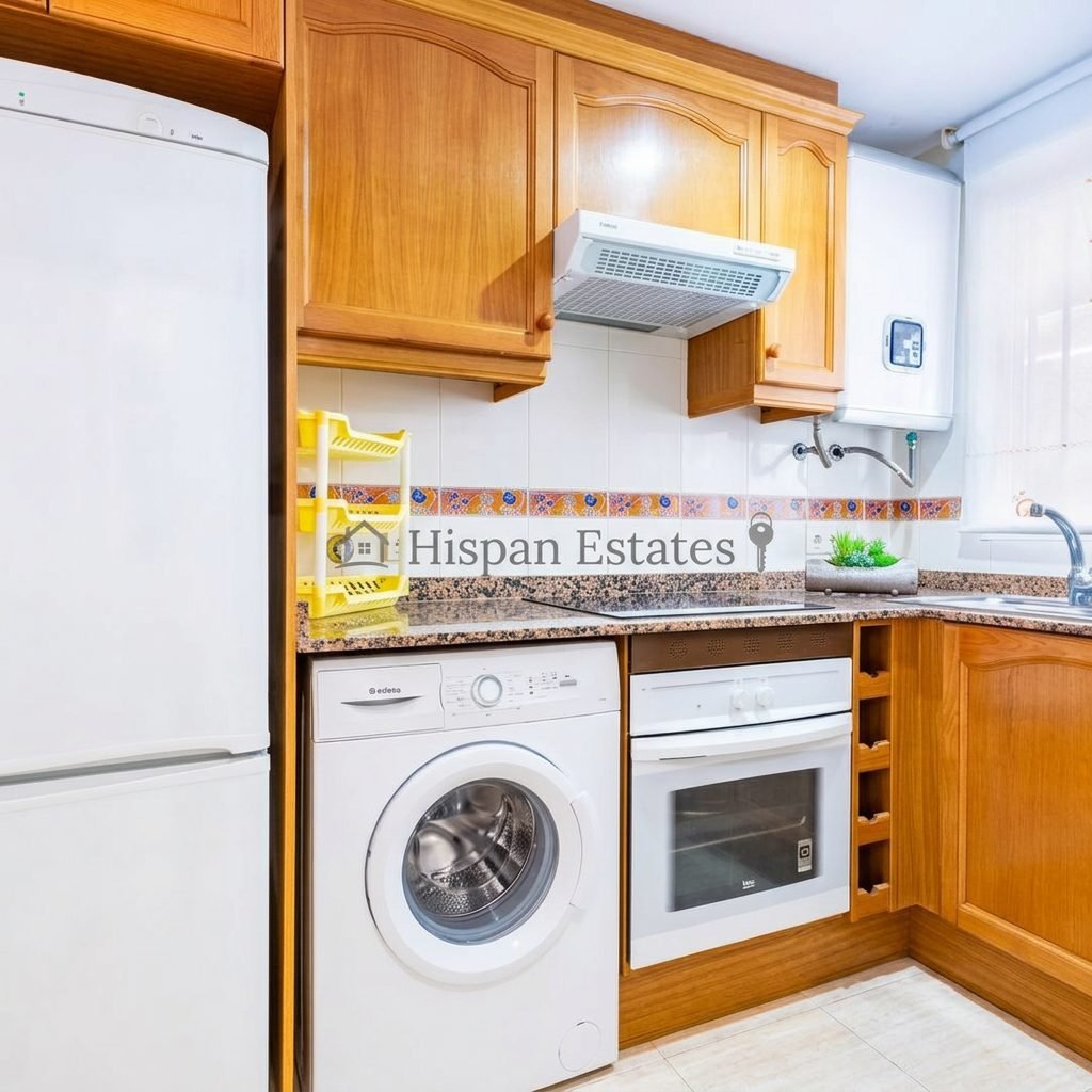 Fitted kitchen with oven and washing machine